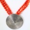 Estate unmarked sterling silver coral beaded necklace with a large round bohemian pendant