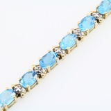 Estate 10K yellow gold diamond & blue topaz tennis bracelet