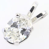 Estate unmarked platinum diamond solitaire pendant