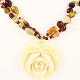 Vintage genuine ivory carved rose pendant on a double-strand glass bead necklace