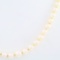 Estate cultured pearl necklace with an unmarked 14K white gold & diamond fish hook clasp