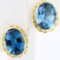 Pair of estate 14K yellow gold blue topaz stud earrings