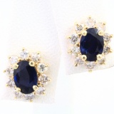 Pair of 14K yellow gold diamond & natural sapphire stud earrings