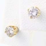 Pair of estate unmarked 14K yellow gold diamond stud earrings