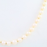 Estate cultured pearl necklace with an unmarked 14K white gold & diamond fish hook clasp