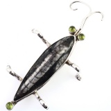 Authentic vintage Margaret Thurman “The Dreamer” fossil stone & peridot sterling silver insect pin