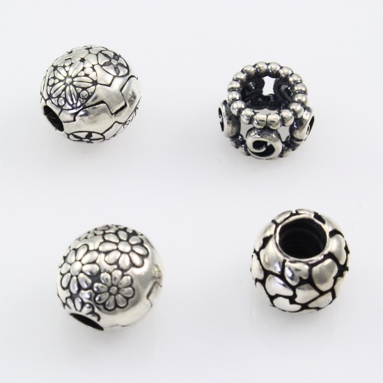 Lot of 4 authentic Pandora sterling silver flower, heart & swirl beads