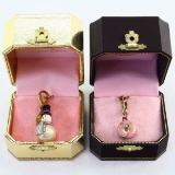Pair of like-new-in-the-box Juicy Couture charms