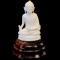 Vintage genuine ivory Buddha hand-carved figurine on wooden base