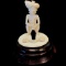 Vintage genuine ivory snake charmer hand-carved figurine on wooden base