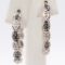 Pair of estate sterling silver black & white diamond earrings: hinged-back, 1'' diameter