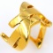 Authentic estate Yves Saint Laurent yellow gold-plated logo ring