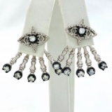 Pair of estate Kendra Scott white metal & white stone fan earrings on earring card: post backs