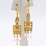 Pair of authentic estate Givenchy yellow gold-plated white crystal dangle earrings