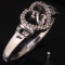 Estate sterling silver black & white diamond heart ring