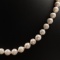 Vintage cultured pearl necklace with a 14K yellow gold diamond & pearl cluster clasp