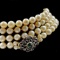 Vintage cultured pearl necklace with an 18K gold & sterling silver diamond & natural emerald clasp