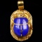 Vintage unmarked 18K yellow gold lapis lazuli scarab beetle pendant