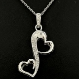 Estate sterling silver diamond double heart pendant
