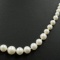Estate cultured white graduated pearl necklace with 14K yellow gold clasp