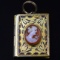 Antique yellow gold-filled enameled hand-carved shell cameo locket