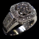 Estate unmarked 18K white gold diamond halo ring