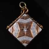 Circa 1889 two-tone gold-filled locket with original bezel & white stone accent