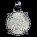 1921 U.S. Morgan silver dollar in a fancy white metal bezel