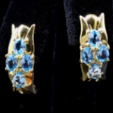 Pair of estate 14K yellow gold blue topaz simulant J-hoop earrings