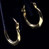 Pair of estate 14K yellow gold small faceted hoop earrings
