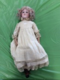 Doll in Cream dress missing a foot
