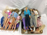 Assortment of Barbie and Ken Dolls