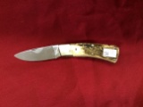 German Hen & Roster stag handle single blade, stain on front and back bulst