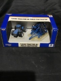 Ertl New Holland TJ530 tractor with the field