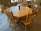 Claw Foot Table 60”x29” w/ lazy susan 12.5”x10” and (7) Chairs 16”