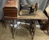 Household treadle sewing machine with cover