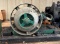 Cast Iron and Steel Belt-Driven Machine Component on Wooden Base