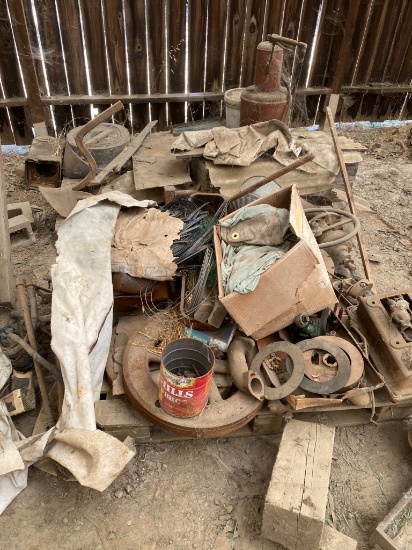 Two Skids of Tractor Parts Including Steering Wheel and Metal Components