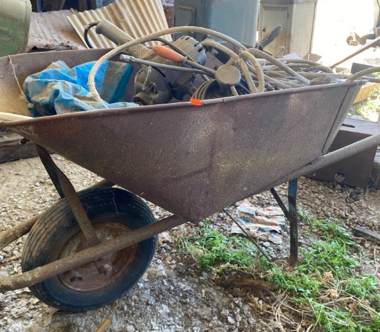 Metal Wheelbarrow with Contents Including Hoses and Tools