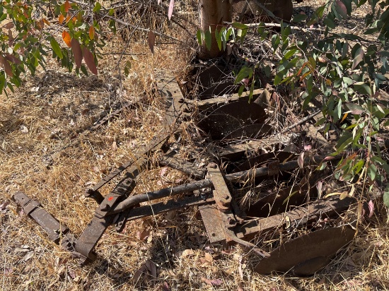 Rusty Steel Agricultural Plow with Blade Attachments