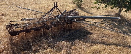 Metal Farm Implement Frame with Attached Pipes and Components