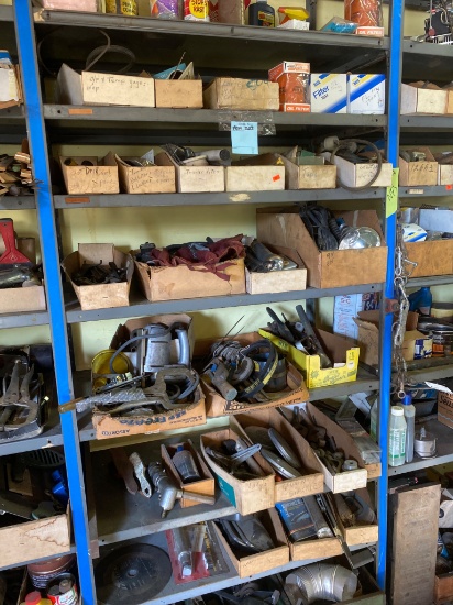 Contents of Parts Shelf Including Tools, Mechanical Components, and Aerosol Cans