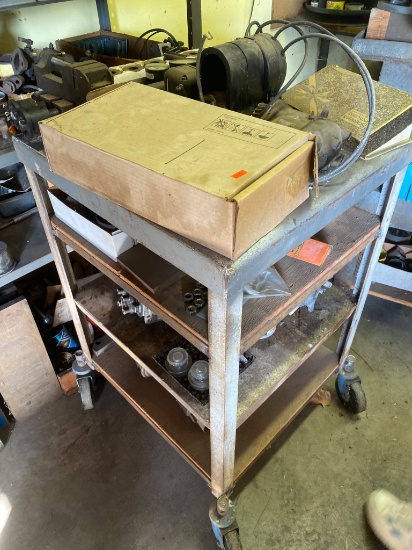 Parts Shelf Contents Including Gauges, Motors, and Miscellaneous Components