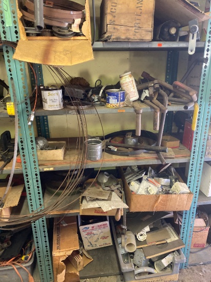 Contents of Parts Shelf Including Various Mechanical Components and Hardware