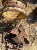 Rusted Metal Objects and Tractor Wheel Rim