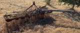 Metal Farm Implement Frame with Attached Pipes and Components