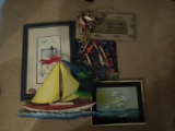 fish place mats, lighthouse picture, wall hanging with lures