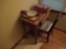 Wooden desk and chair, includes contents on top, candles, plates, ect.