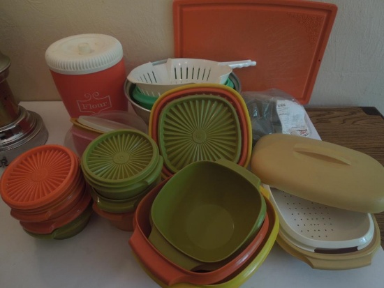 Tupperware, strainers, steamer, cutting board, flour canister