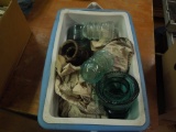 Cooler with assorted glass insulators, roll of telephone wire